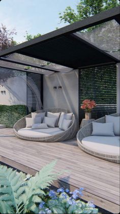 an outdoor living area with couches, tables and plants on the decking space