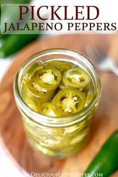 pickled jalapeno peppers in a jar on a cutting board