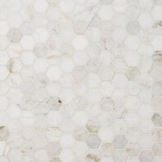 a white marble tile with hexagonal pattern