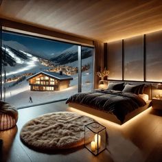 a bedroom with a large window that looks out onto the snow covered mountains and houses