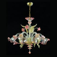 a chandelier hanging from the ceiling with pink flowers on it