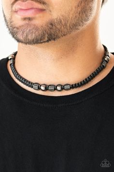 Sections of gunmetal beads and studded hexagonal accents are knotted in place along a black cord that has been braided around the neck for a seasonal look. Features a button loop closure. Sold as one individual necklace. Adjustable Gunmetal Beaded Jewelry, Adjustable Black Beads Necklace For Festivals, Adjustable Beaded Gunmetal Jewelry, Black Gemstone Beaded Necklaces For Festivals, Necklace Men Diy, Beaded Necklace Men’s, Masculine Beaded Necklace, Black Casual Necklace With Adjustable Cord, Casual Black Necklace With Adjustable Cord