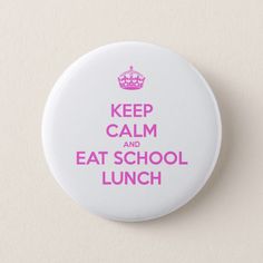 a button with the words keep calm and eat school lunch in pink letters on it