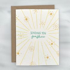 a greeting card with the words sending you sunshine on it and sunbursts