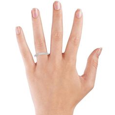 a woman's hand with a diamond ring on her left thumb and the middle finger