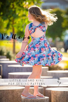 Create timeless elegance with the Vallejo Dress and Top Sewing Pattern! This versatile design features a chic back bodice with options for a simple or statement bow detail. Choose from flutter, short, elbow, or sleeveless styles, with optional ruched detailing on short and elbow sleeves. The pattern includes a simple skirt in dress or top lengths and a tiered skirt option for dress-length. No closures make it an easy sew. Sizes 12 months - 14 years.