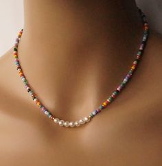 The necklace is made of 5 mm. freshwater pearl and multi color seed beads.   A length is 15.75'' ( 40 mm. ) and 2'' (5 cm. extender ). The necklace will be packaged in a gift box. The necklace is ready to ship. Thank you for visiting my shop. Seed Beads Necklace, Beaded Jewelry Necklaces, Dainty Choker, Beaded Jewels, Necklace Minimalist, Beaded Brooch, Seed Bead Necklace, Lovely Earrings