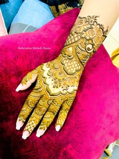 a woman's hand with henna on it