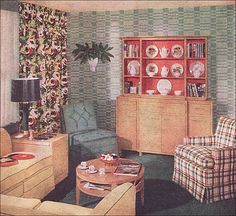 a living room filled with furniture next to a wall covered in floral wallspapers