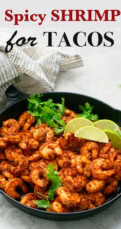 spicy shrimp in a skillet with cilantro and lime garnishes