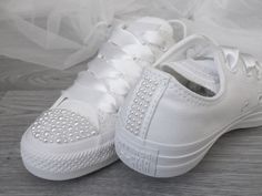 Make your special day unforgettable in White Pearl Wedding Converse for Brides. These elegant and bridal trainers feature white pearls and satin ribbon laces, offering an exquisite blend of femininity and comfort. Perfect for the modern bride. To meet your individual requirements and colour scheme pearl/ribbon colours can be changed on request. Pearl Embellished Lace-up Wedding Sneakers, Bridal Trainers, Sneakers Bride, Pearl Converse, Wedding Trainers, Personalized Converse, Converse Wedding, Bridal Converse, Pearl Ribbon