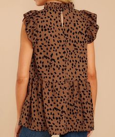 Product Details: Features a light to medium weight cheetah print fabric. Ruffled high neck, ruffled cap sleeves, peplum bottom, and keyhole back closure with button. Color - Brown 85% Polyester, 15% Rayon Delicate Wash Cold Water / Line Dry Made in China Item #S202SYC007 Size & Fit: Extra Loose Fit Model is wearing a S Note: I wear a Small in this top being 5'3 (36D,29,37). Spring Leopard Print Tops With Ruffles, Summer Ruffle Tops In Leopard Print, Leopard Print Ruffled Top For Summer, Summer Ruffled Leopard Print Tops, Summer Leopard Print Ruffle Tops, Babydoll Shirt, Leopard Blouse, Women's Button Down Shirt, Clubwear Dresses