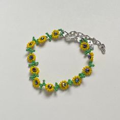 "Handmade Beaded Bracelet 🌻 I also have a matching necklace available ✿ Made with glass seed beads, glass crystal beads, and metal accents ✿ Green, yellow, and multicolored/oil-slick ✿ 6.75 - 7.25\" (slightly stretchy) plus 2\" of extension chain" Yellow Beaded Chain Bracelet, Yellow Beaded Chain Bracelets, Yellow Czech Glass Bracelets With Round Beads, Adjustable Yellow Beaded Bracelets With Beaded Chain, Green Beaded Flower Crystal Bracelet, Adjustable Yellow Beaded Bracelet, Adjustable Yellow Beaded Chain Bracelets, Yellow Beaded Bracelets With Spacer Beads, Yellow Beaded Czech Glass Bracelets