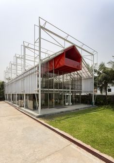 an empty building with red and white architecture