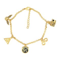 a gold bracelet with charms on it that says 90 and has the number nine eleven