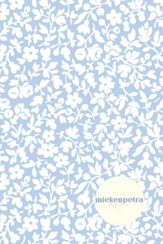 a blue and white wallpaper with flowers on it