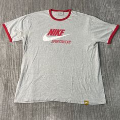 Vintage 2000s Nike Sportswear Athletic Swoosh Check Logo Streetwear Y2K Aesthetic Grey Graphic T Shirt Extra Large Mens Condition:  Excellent Used Condition  = No Flaws Measurements: Please see photos above for all measurements IF YOU BUY TWO OR MORE ITEMS USE THE CODE BUNDLE @ CHECK TO SAVE 20% WE SHIP WITHIN 24 HOURS AFTER PURCHASE! Please be aware that we do not offer free returns!! The Buyer is responsible for the cost of the return label.  Follow us on TikTok & Instagram @findsnostalgic and Gray Sportswear Top For Streetwear, Athletic Heather Tops With Logo For Sports Events, Gray Sports T-shirt, Sports T-shirt With Logo Print, Athletic Heather Crew Neck T-shirt For Sports, Gray Sporty T-shirt For Sports, Varsity Style Sports T-shirt With Crew Neck, Varsity Sports T-shirt With Crew Neck, Varsity T-shirt With Crew Neck