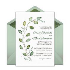 a wedding card with green leaves on it