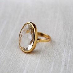 D E T A I L S - Material: 92.5 sterling silverStone: CrystalThe fit: true to US ring size Finish: smooth and Gold Plated to a high shineS H I P P I N G & P R O D U C T I O N - My current production time is 2-6 business days, which means after those days are up, your order ships! I make everything custom to order, by hand, but I promise you it's worth the wait!R U S H - M Y - O R D E R -If you're in a rush to get your pretty new pieces, please send me a message and I'll let you know just how Clear Quartz Ring, Your Pretty, Chalcedony Ring, Textured Ring, Worth The Wait, Everyday Rings, I Promise You, Crystal Ring, Onyx Ring