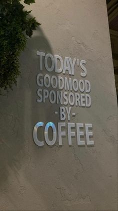 there is a sign that says today's goodmood sponsored by coffee