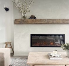 a living room with a fire place and coffee table