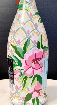 a painted bottle sitting on top of a table