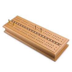 a wooden board with pegs and screws in it on a white background,