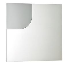 a white square shaped mirror on the wall