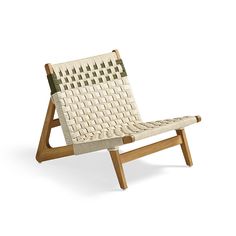 a chair made out of woven material and wooden legs, sitting on a white background