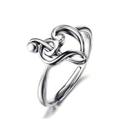 Crafted with passion and precision, our Sterling Silver Treble Clef Bass Heart Music Note Ring for Women celebrates the harmonious beauty of music. Designed by Innovato Design, this ring is more than a piece of jewelry; it's a symphony of style and elegance. Made from high-quality sterling silver, this ring features a unique design that combines a treble clef, bass clef, and heart-shaped music notes, symbolizing the love and passion for music. The resizable feature ensures a comfortable fit for any finger size, allowing you to wear it with ease and confidence. Whether you're a musician or simply appreciate the artistry of music, this ring is the perfect accessory to showcase your love for melodies and rhythms. Its timeless design and impeccable craftsmanship make it suitable for everyday w Treble Clef Jewelry, Music Note Ring, Music Rings, Wedding Ring Sizes, Treble Clef, Music Note, Vintage Music, Rings For Women, Wedding Rings For Women