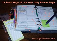 an open planner book sitting on top of a wooden table