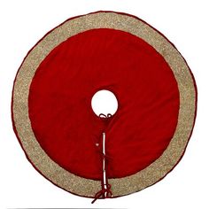 a red and gold round cushion on a white background with the bottom part of it showing