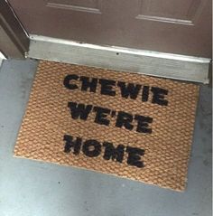 a door mat that says chew we're home