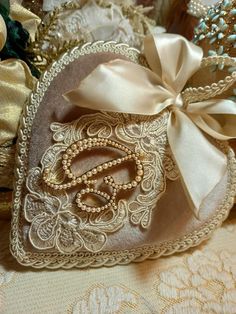 a decorative bag with the letter g on it and a ribbon tied around it's corner