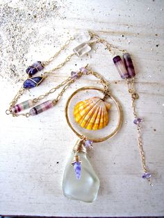 The Sunrise Shell is prized for its rarity. It is found only in the Hawaiian Islands, and rarely found on the beach. Most of them are found by divers, deep in the ocean. My Sunrise Shells are found by my husband and a close family friend. Our Sunrise Shell creations are a true LABOR OF LOVE. From my husband diving to extreme depths to unearth these beauties beneath layers of sand, to the labor-intensive processing of the shell (to remove any natural calcification of the shell), to the final desi Shell Creations, Sunrise Shell, Beach Jewelry Boho, Close Family, Fluorite Stone, Golden Rutilated Quartz, Necklace Amethyst, Hawaii Beach, Sea Glass Pendant