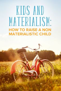 a red bike sitting in the grass with text overlay that reads kids and materialism how to raise a non - material child