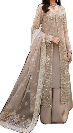 Elegant Lehenga With Sheer Dupatta, Elegant Semi-stitched Wedding Dress With Traditional Drape, Elegant Traditional Wear With Sheer Dupatta For Reception, Elegant Beige Sets With Traditional Drape, Elegant Beige Set With Traditional Drape, Elegant Chinon Gown, Beige Saree Dress For Reception, Elegant Designer Beige Sets, Elegant Beige Gown With Sheer Dupatta