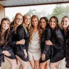 a group of women standing next to each other