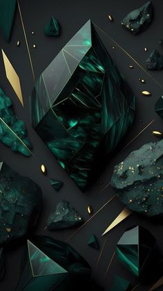 some green rocks and gold foil on a black background with an image of a diamond in the center