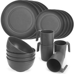 a set of grey dinnerware with cups and saucers