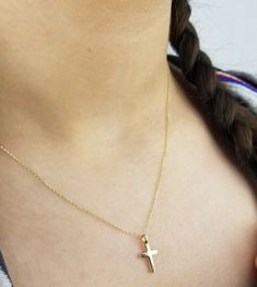 14K SOLID YELLOW GOLD SMALL CROSS NECKLACE Here is a dainty, delicate and simple, yet classy minimalist Cross Necklace. This is 14k Solid Gold. (We do not sell filled or plated jewelry) Perfect for everyday use. Metal : 14K Solid Gold Necklace Length : 17 inches / 42.5cm Cross Height : 16mm Cross Width : 8mm ---Absolutely stunning. Comes in a gift box. ---Shipping Policy---- Item will be shipped within 1-3 business days of receiving full payment. ---Return Policy--- -You may return the unused it Minimalist Cross Jewelry For First Communion, Gold Personalized Minimalist Cross Necklace, Gold Minimalist Personalized Cross Necklace, Minimalist Personalized Gold Cross Necklace, Minimalist Gold Jewelry For Baptism, Dainty Gold Cross Necklace For Baptism, Gold Hypoallergenic Cross Necklace, Dainty Gold Jewelry For First Communion, Small Cross Necklace