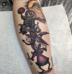 a person with a tattoo on their leg that has an image of a skeleton riding a horse