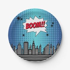 a plate with the word boom on it in front of a cityscape background