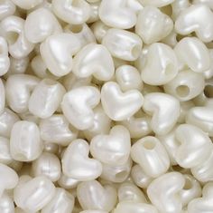 some white pearls are piled up together