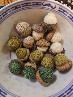 small knitted balls in a bowl on a table