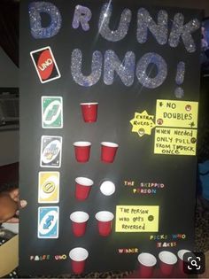 a sign that says drunk uno with cups and sodas on it's side