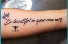 a person with a tattoo on their arm that says be beautiful in your own way