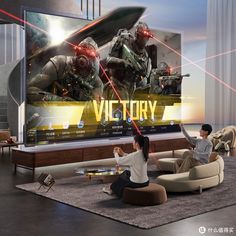 two people sitting in front of a large television screen with the words victory on it