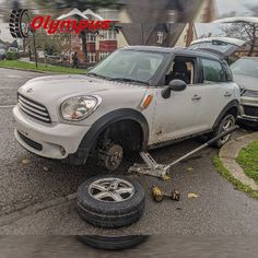 a car that is on the side of the road with it's tire in front of it