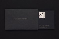 a black and white business card with the words $ 600 printed in gold on it